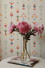 Self-adhesive wallpaper with an ornamental design of symmetrical floral patterns in pastel and earthy tones, creating a vintage-inspired aesthetic.