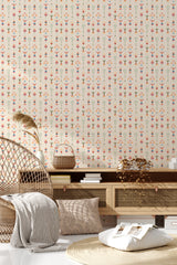 A decorative pattern of small, colorful floral motifs arranged in vertical rows on a beige background, creating a delicate and symmetrical design, traditional wallpaper.