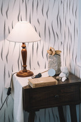 Self-adhesive Zebra stripe wallpaper with vertical, flowing black lines on a white background.