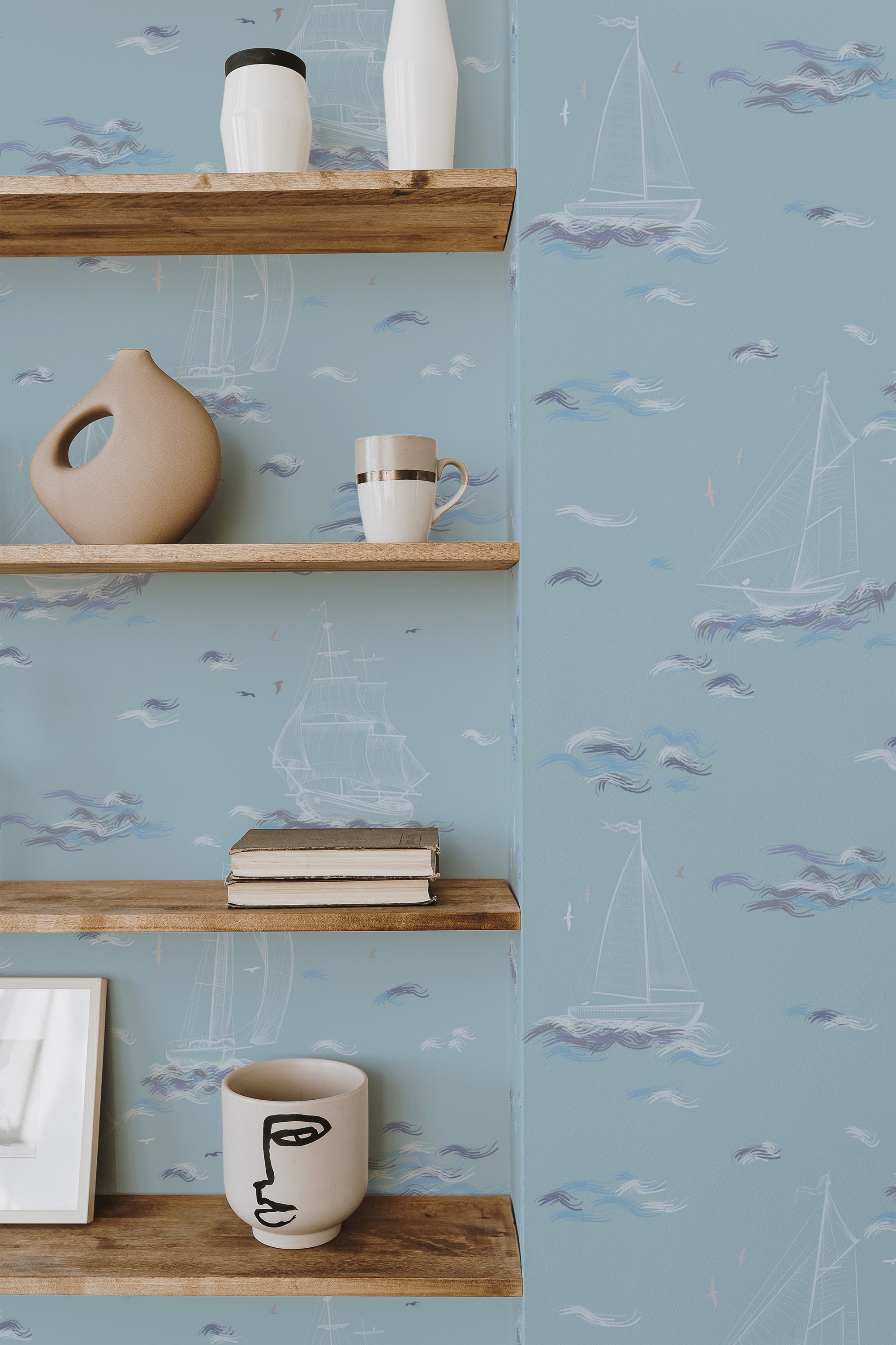 Self-adhesive wallpaper with a light blue sea theme, adorned with delicate sailboats, soft waves, and subtle cloud designs.