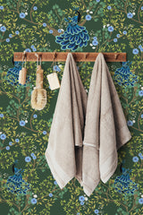 Self-adhesive wallpaper with a vibrant peacock design, featuring teal and blue peacocks perched among intricate branches filled with green leaves and delicate blue flowers, creating a lively and natural ambiance.