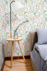Self-adhesive wallpaper with a Soft fall design, showcasing delicate floral patterns in soft pastel colors like green, pink, and orange, creating a calming, nature-inspired atmosphere in the room.