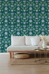 Art Nouveau wallpaper with a bold teal background adorned with white flowers, green leaves, and abstract swan patterns, creating a vibrant and intricate design that enhances the room's aesthetic. Traditional wallpaper.