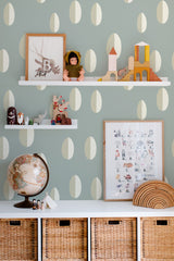 Self-adhesive wallpaper featuring a raindrop pattern on a soft green background with white teardrop shapes arranged in a symmetrical, repeating pattern.
