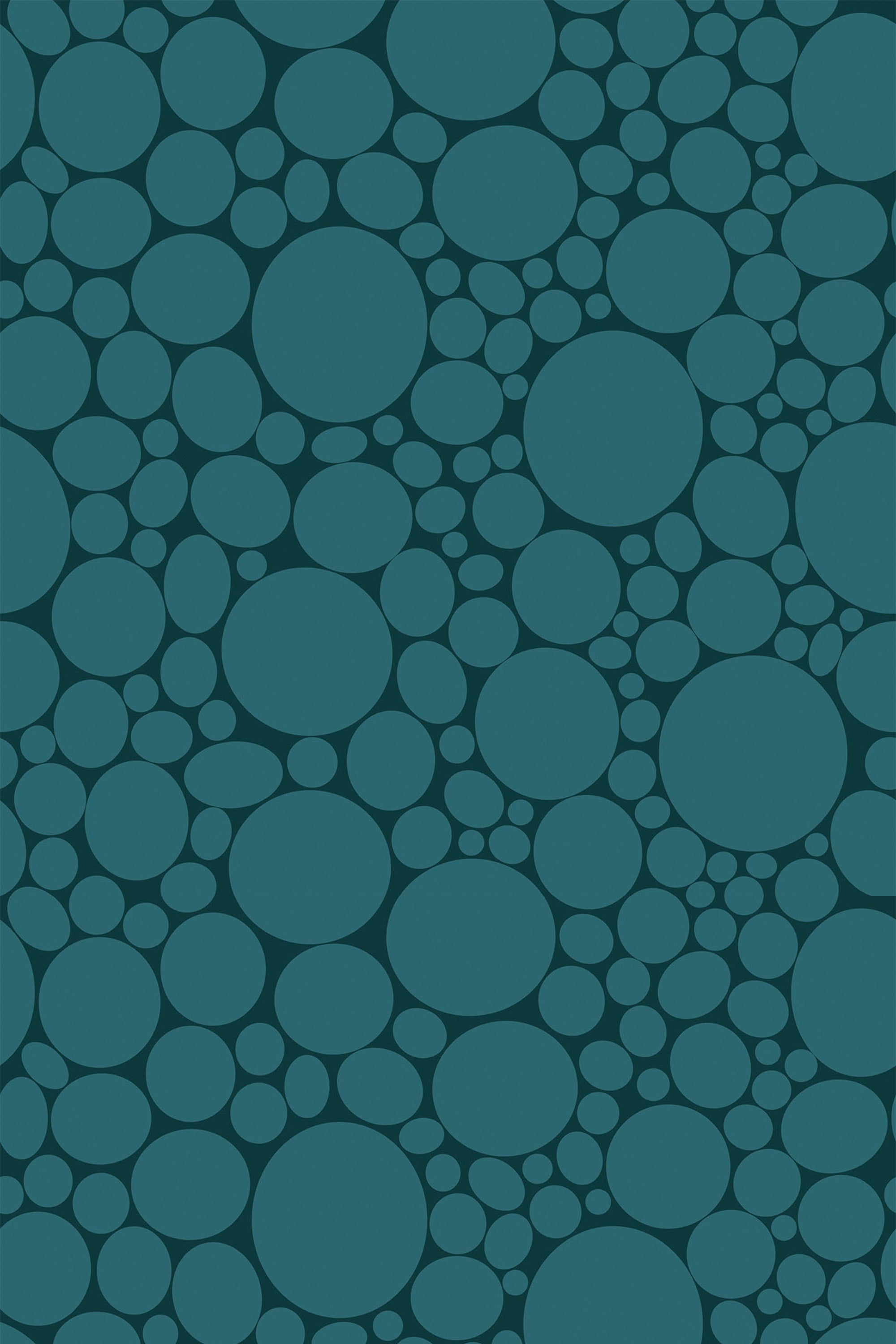 A repeating pattern of various-sized blue circular spots on a darker blue background. Peel and stick removable wallpaper.