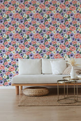 Floral wallpaper in vibrant colors with pink roses, purple anemones, and green foliage pattern, creating a lively and inviting ambiance in the room. Traditional wallpaper.