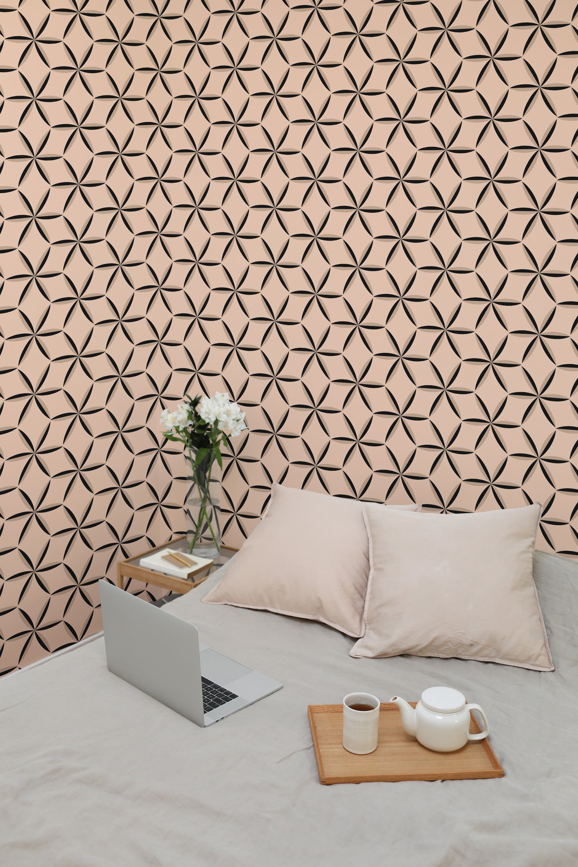 Self-adhesive wallpaper with a Beige stars tile design, creating a geometric pattern on a soft peach-colored background.