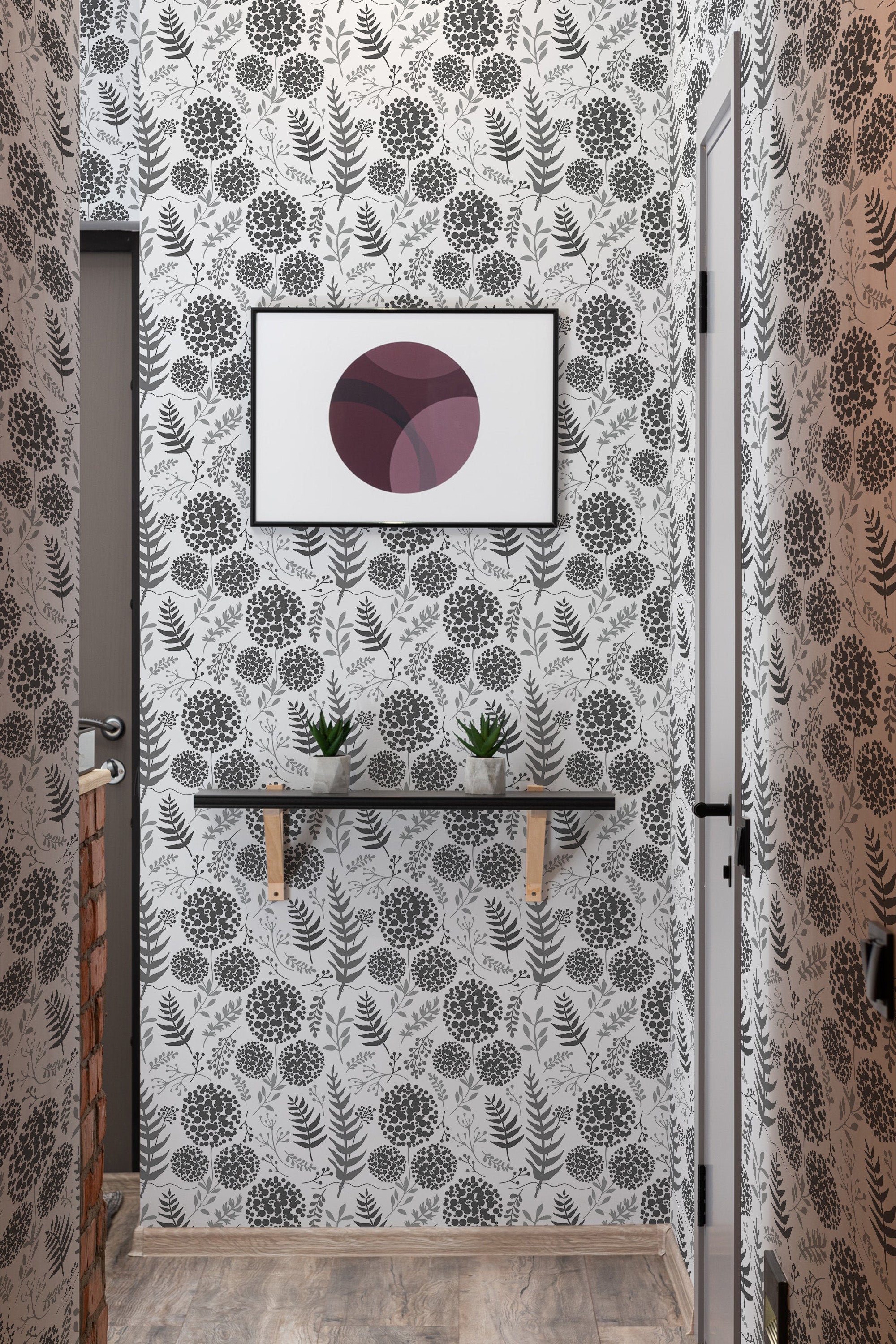 Black and white floral design with intricate, symmetrical patterns of flowers and leaves covering the walls. The wallpaper exudes an elegant, vintage aesthetic, creating a cozy and classic ambiance in the room. Traditional wallpaper.