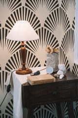 Self-adhesive wallpaper with a Beige arch design on the walls. The pattern has bold, black fan-like shapes that radiate outward on a beige background.