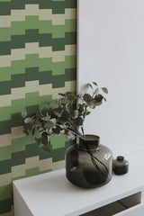 Self-adhesive Green geometric wave wallpaper with overlapping zigzag patterns in varying shades of green and beige.