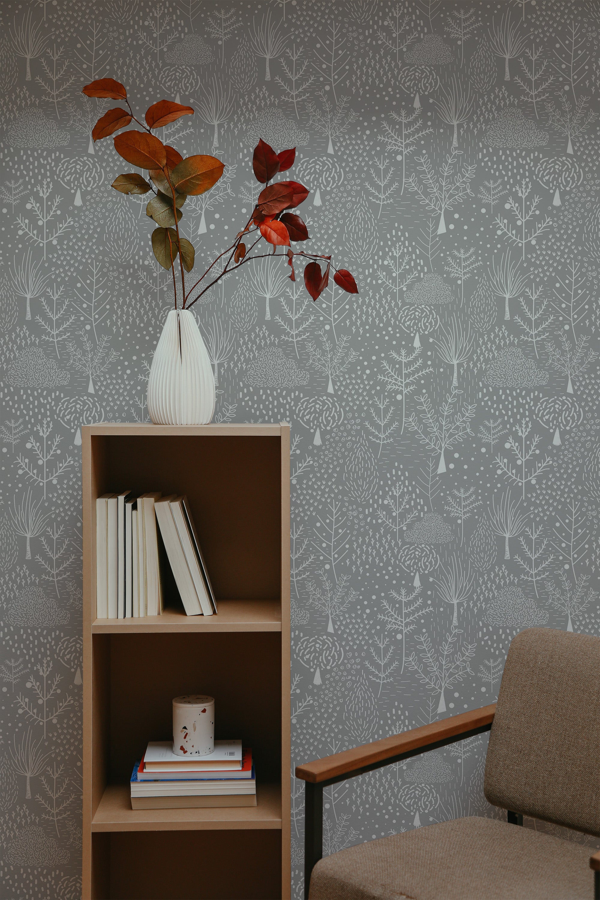 Self-adhesive wallpaper with a subtle snowy forest pattern, showcasing delicate white trees and branches against a soft gray background.