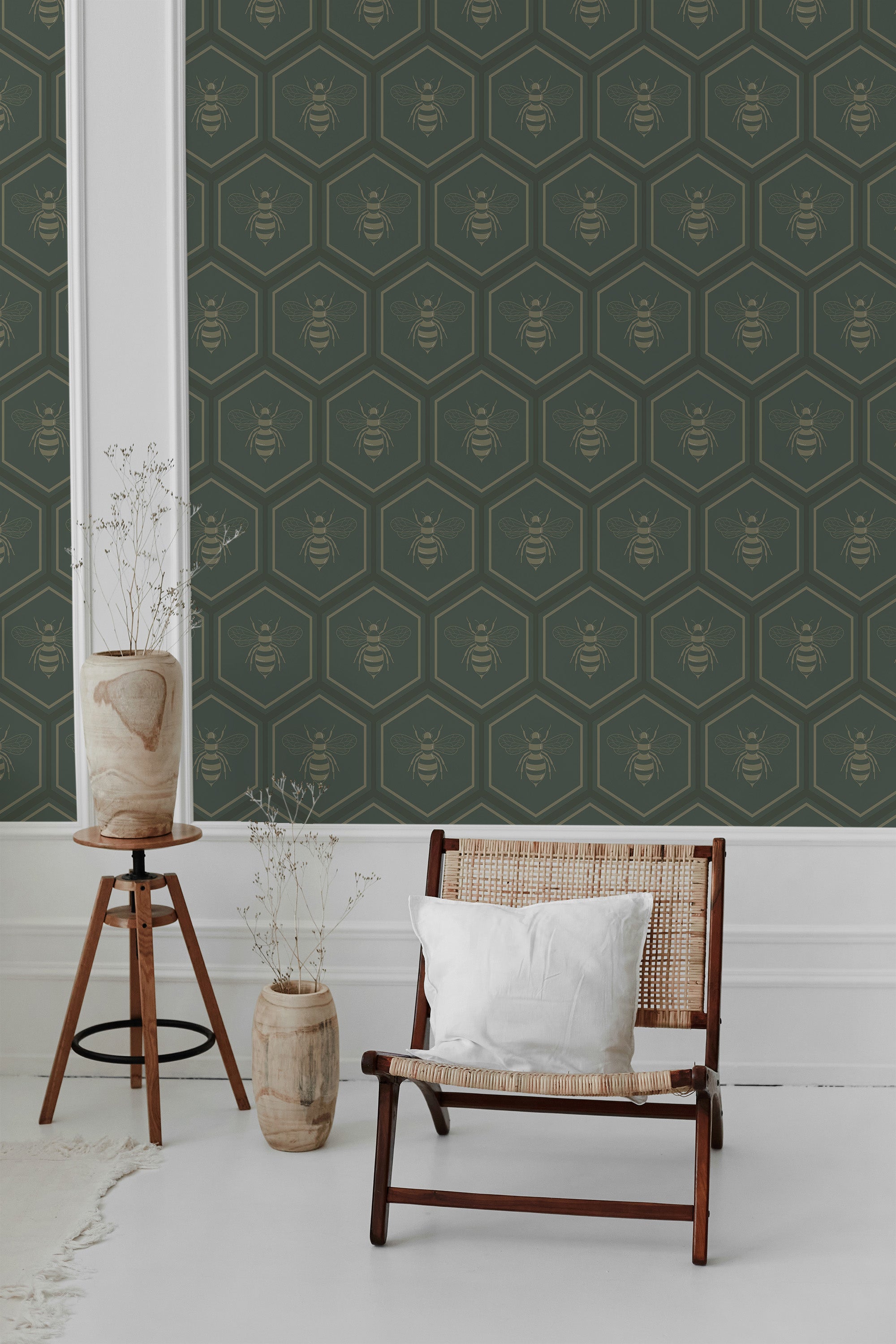 Wallpaper with a bold honeycomb pattern incorporating delicate bee illustrations set against a deep green background, framed by clean white borders. Traditional wallpaper.