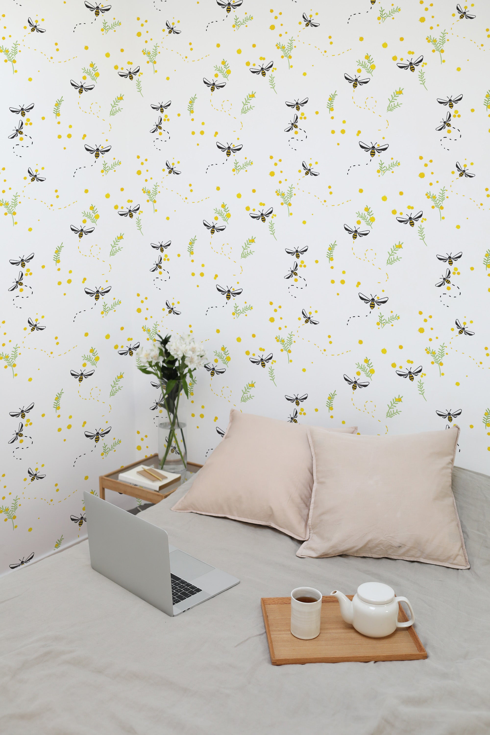 Self-adhesive wallpaper with a bee garden design, showing playful bees surrounded by delicate yellow flowers and green foliage against a white background.