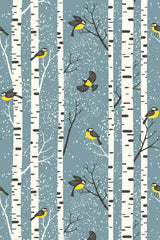Birch trees and birds with yellow and black feathers against a blue background with falling snow create a winter landscape pattern. Peel and stick removable wallpaper.