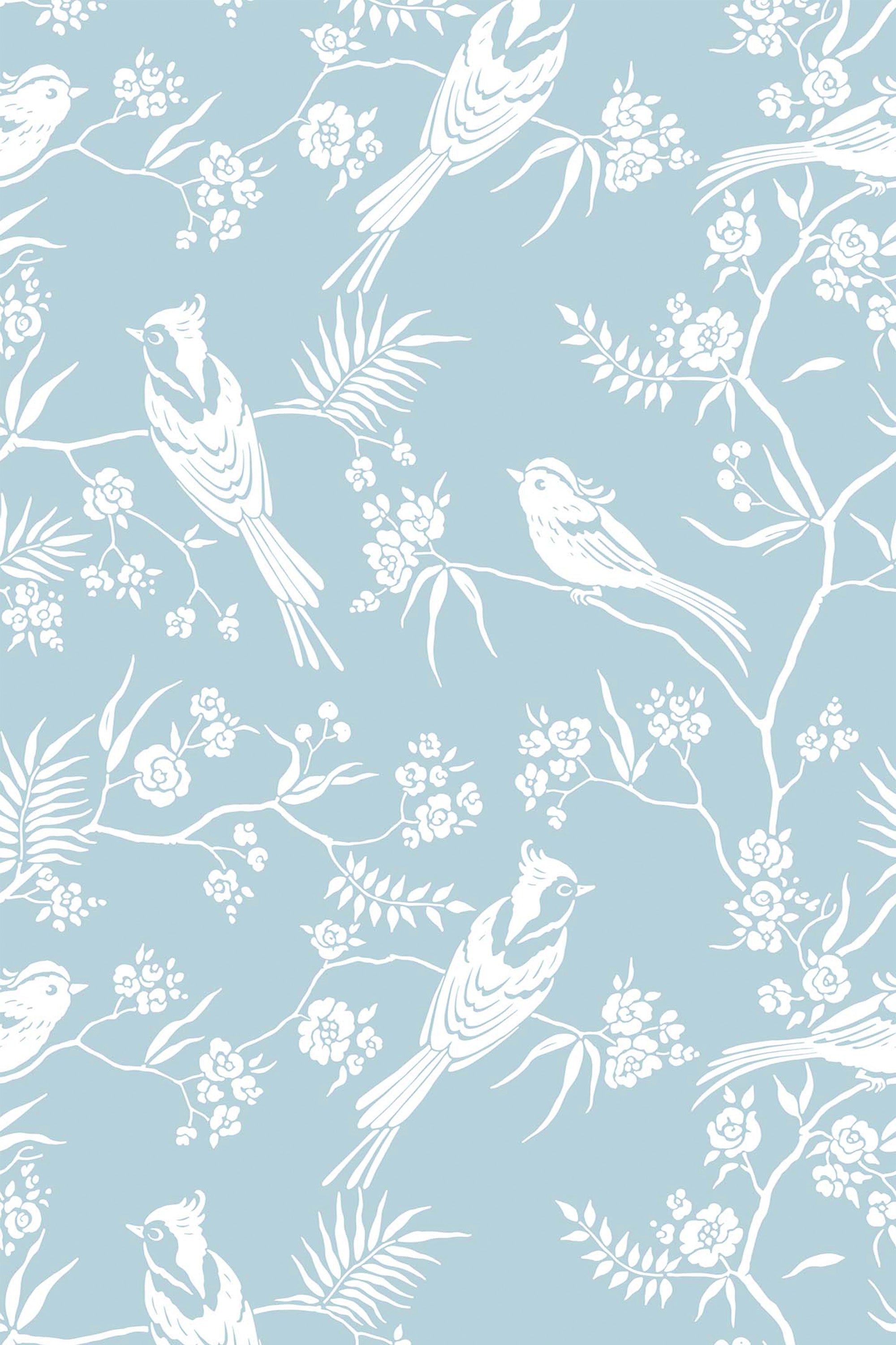 Light blue background with white birds perched on delicate branches adorned with blooming flowers and leaves, peel and stick removable wallpaper.