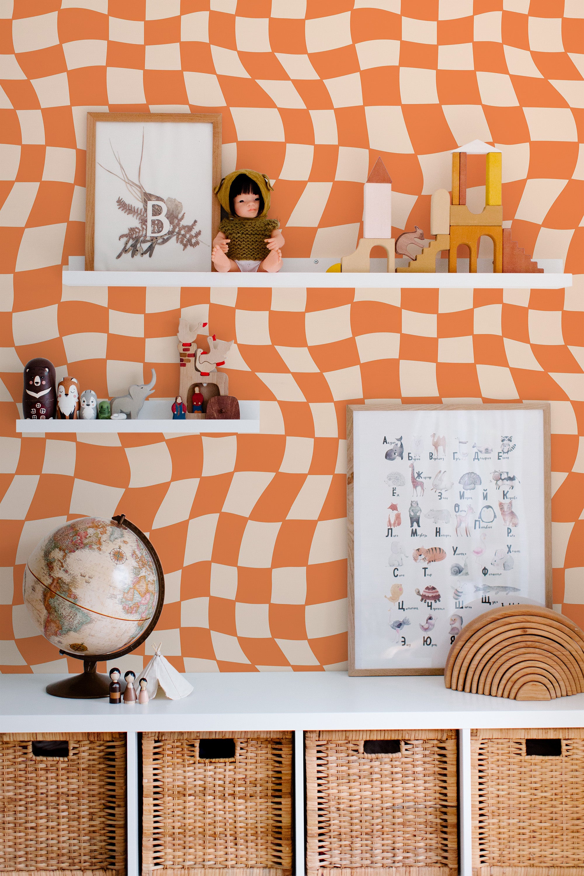 Self-adhesive funky geometric wallpaper with wavy orange and cream checkered patterns creating a dynamic, retro visual effect.
