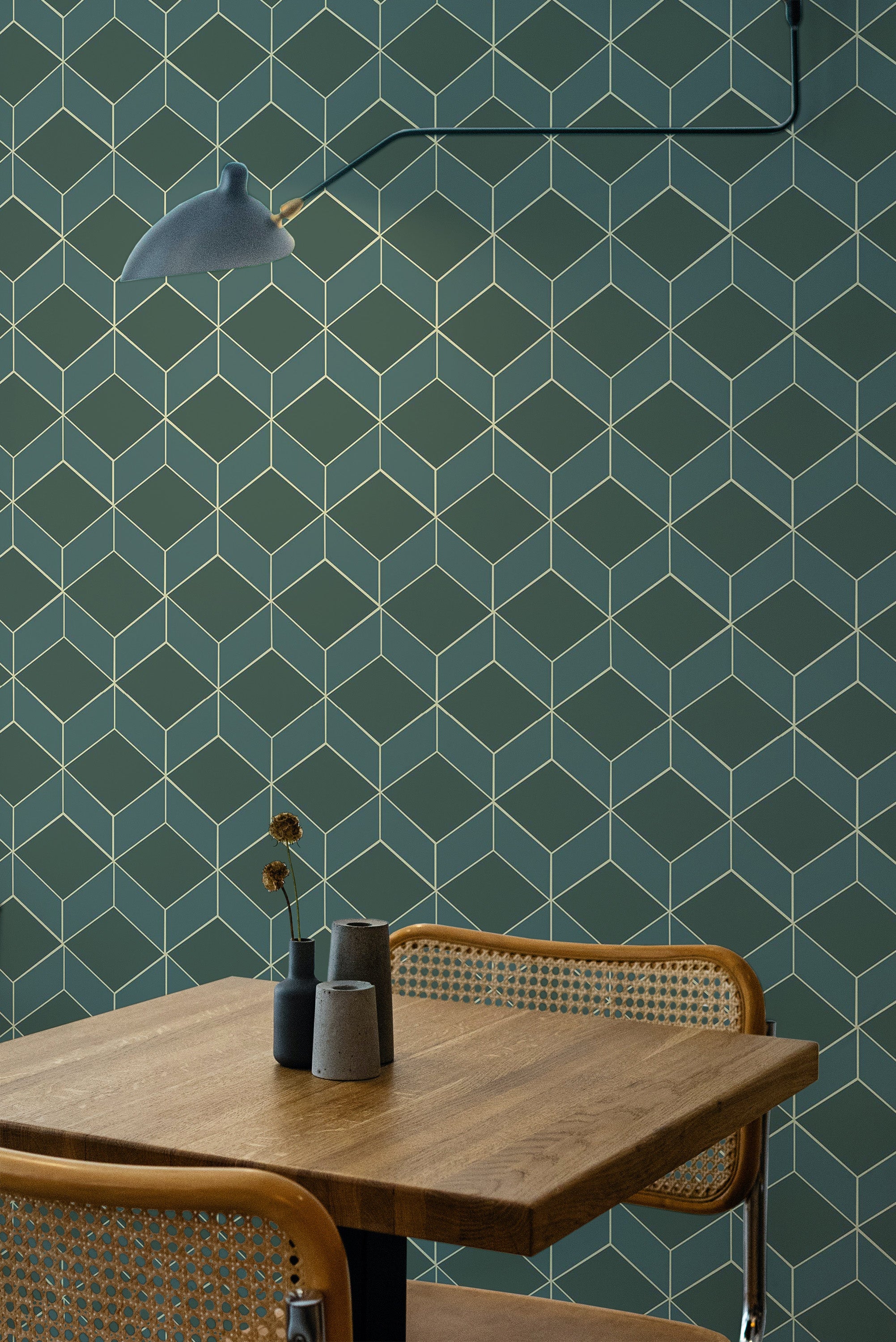 Self-adhesive emerald green art deco wallpaper with a geometric pattern of repeating diamond shapes and fine gold lines against a green background.