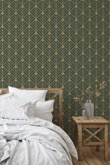 Self-adhesive wallpaper with a green art deco design, featuring gold geometric patterns resembling stylized leaves arranged in a symmetrical, repeating pattern.