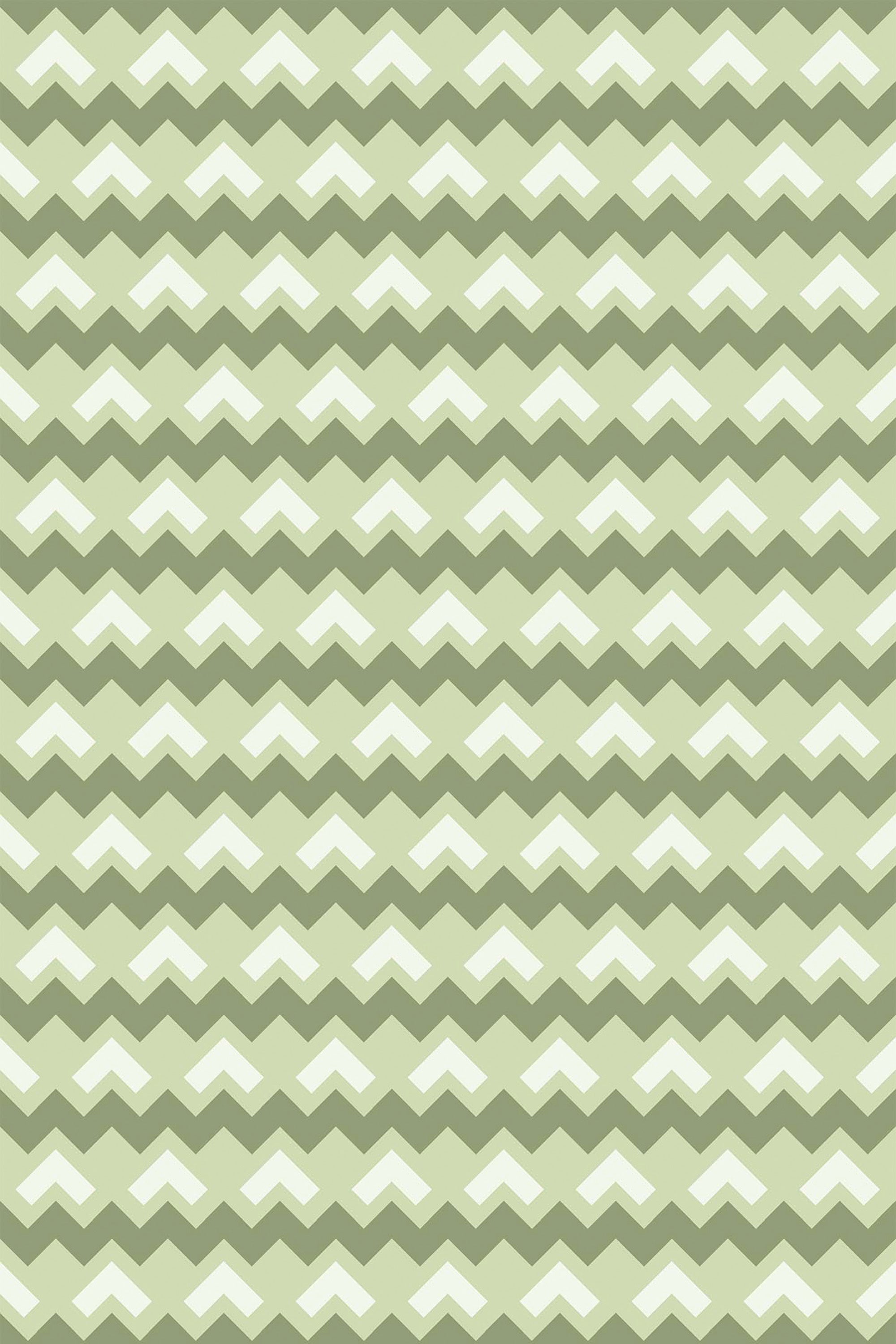 Green chevron pattern with repeating zigzag stripes in various shades of green and white. Peel and stick removable wallpaper.