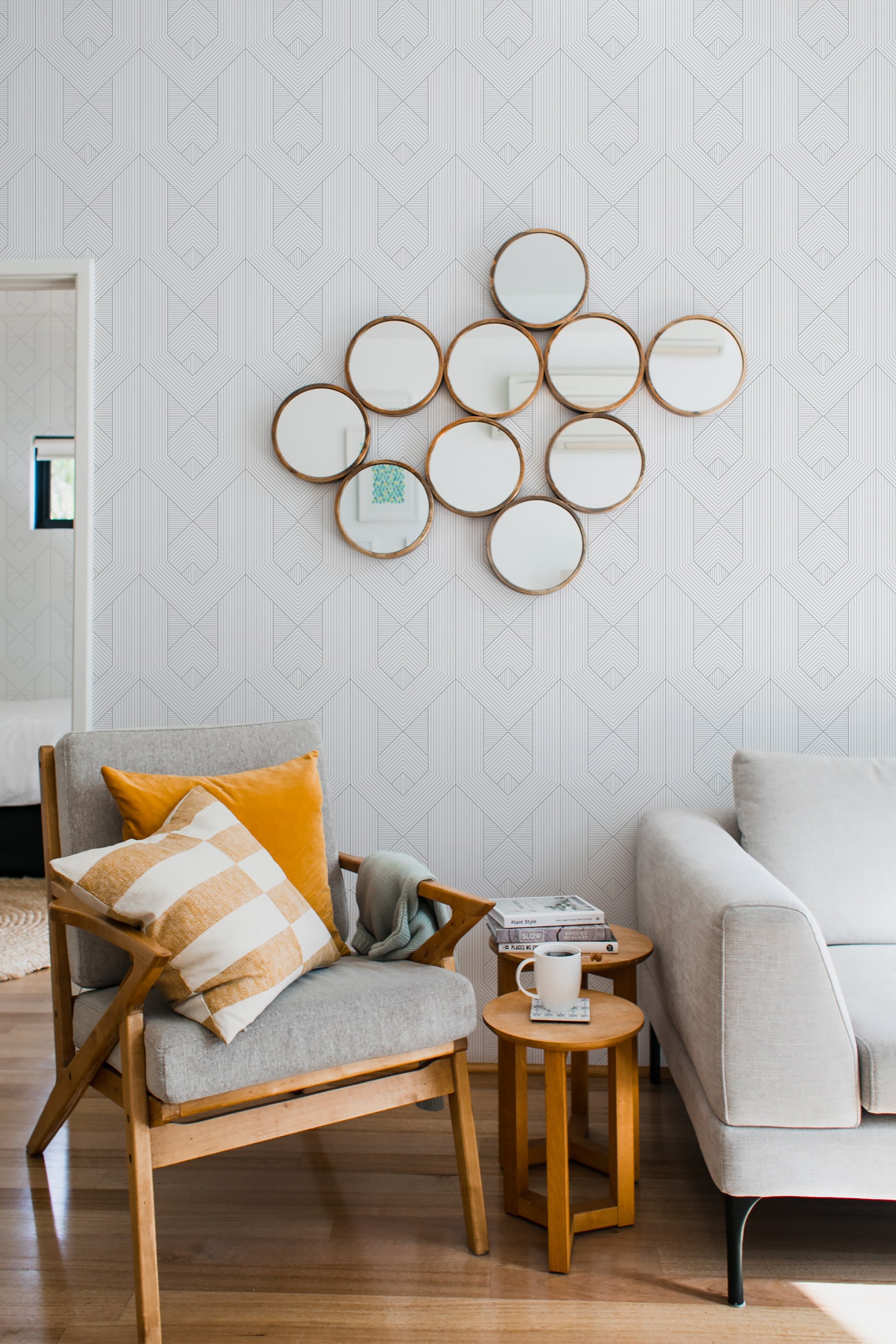 Wallpaper with a subtle geometric pattern of thin, interconnected lines forming abstract shapes on a light background, giving a modern yet classic feel to the space. Traditional wallpaper.