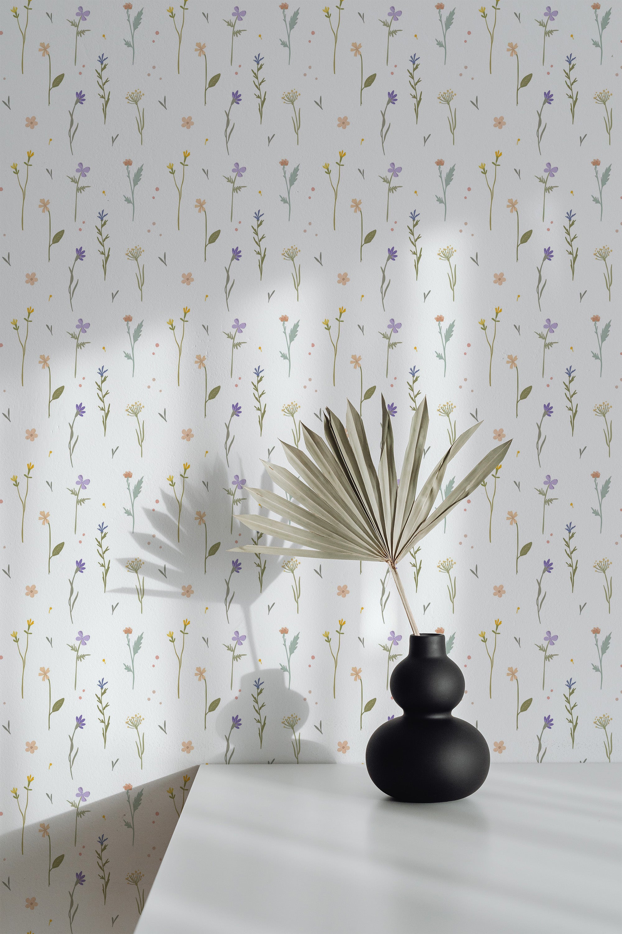 Self-adhesive wallpaper with a delicate floral pattern, featuring small flowers and thin, leafy stems in soft pastel shades on a white background.