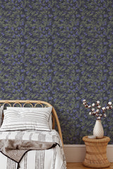 Self-adhesive wallpaper with a realistic blueberry pattern. Blueberries and green leaves are scattered across a dark background, creating a rich and textured nature-inspired aesthetic for the room.
