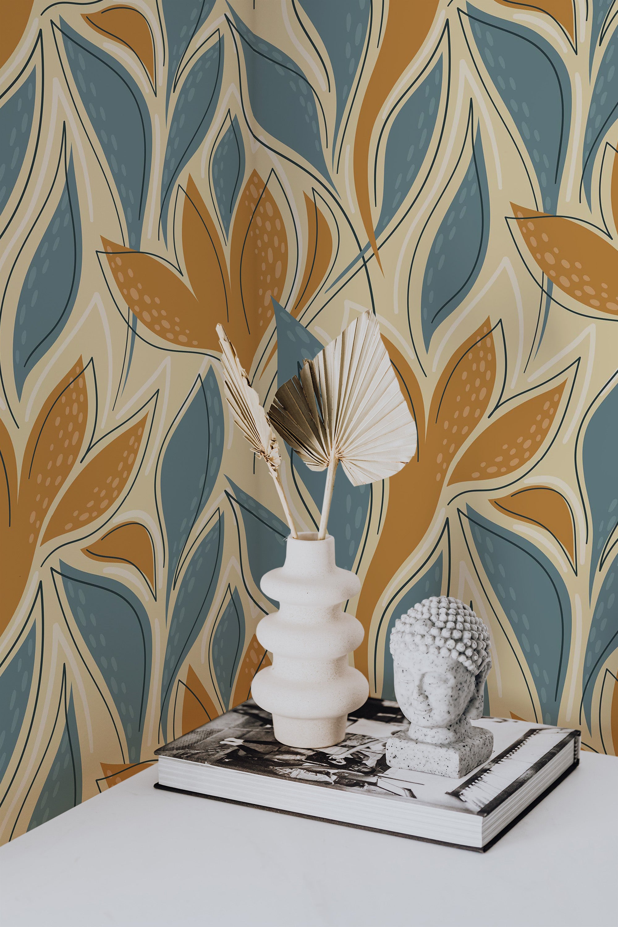 Self-adhesive wallpaper with a blue abstract leaf design incorporating earthy tones of mustard, beige, and teal, creating a vibrant and organic pattern that adds a lively yet calming atmosphere to the room.