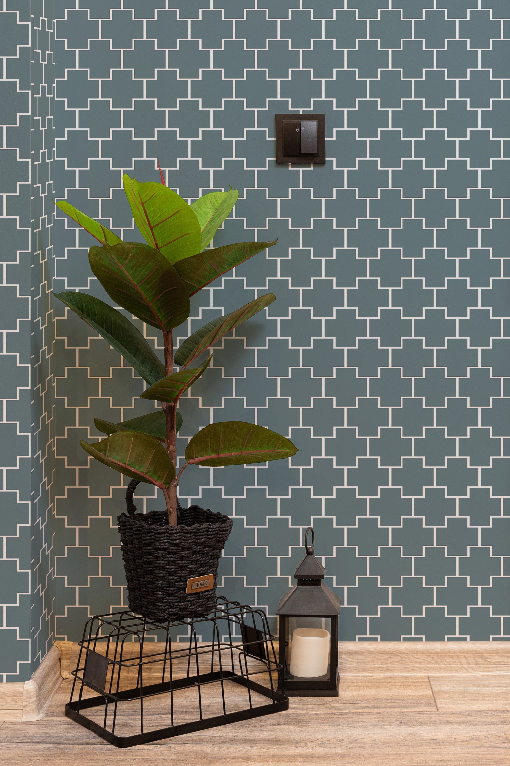 Self-adhesive wallpaper with a Blue cross tile design, characterized by interlocking white cross patterns against a muted dark blue background.