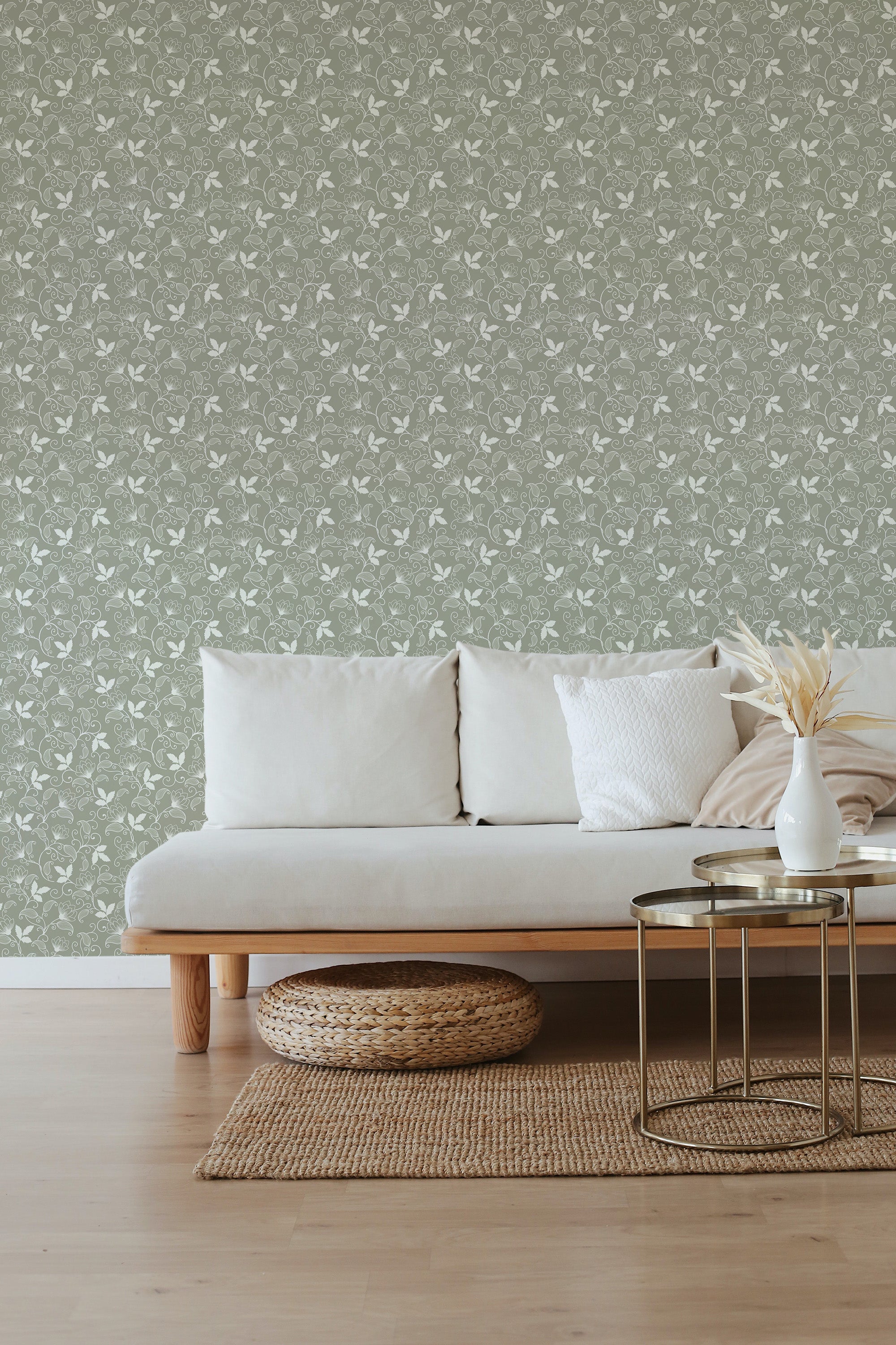 Green floral wallpaper with small, intricate white flowers repeating in a uniform pattern, adding a classic and elegant touch to the room, adorned with complementary neutral furniture. Traditional wallpaper.