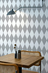 Self-adhesive wallpaper with a Gray argyle design, arranged in a series of diamond shapes featuring alternating light and dark shades.
