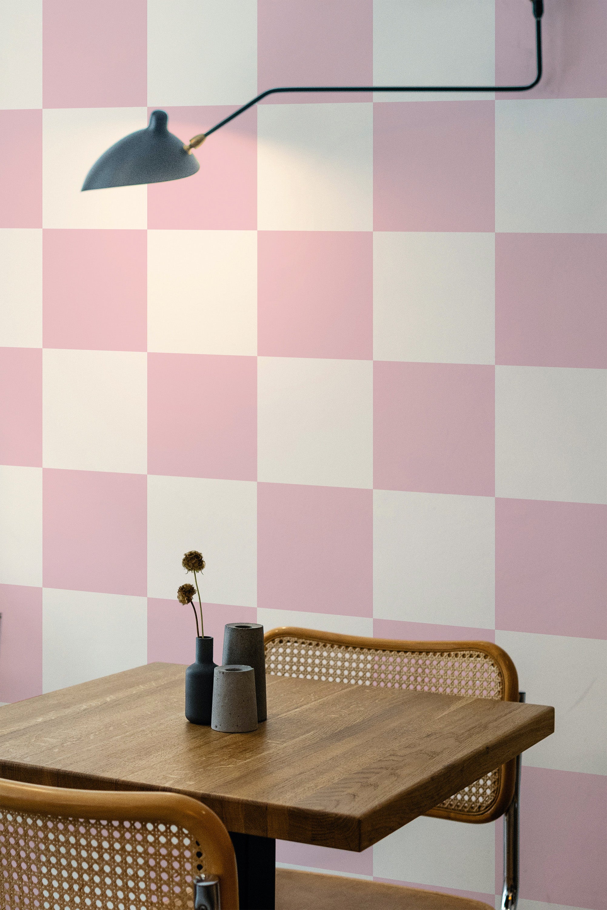 Self-adhesive pink checkered wallpaper with alternating pink and white squares, creating a classic and stylish pattern on the wall.