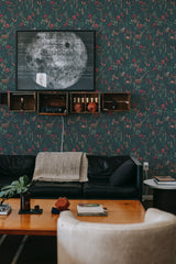 Dark green wallpaper with a subtle, dense forest pattern in shades of deep green, red, and brown, accented with floral elements and woodland creatures. The wallpaper gives the room a cozy, nature-inspired ambiance, complementing the dark furniture and wooden accents. Perfect choice for those looking to bring a touch of the outdoors inside with traditional wallpaper.