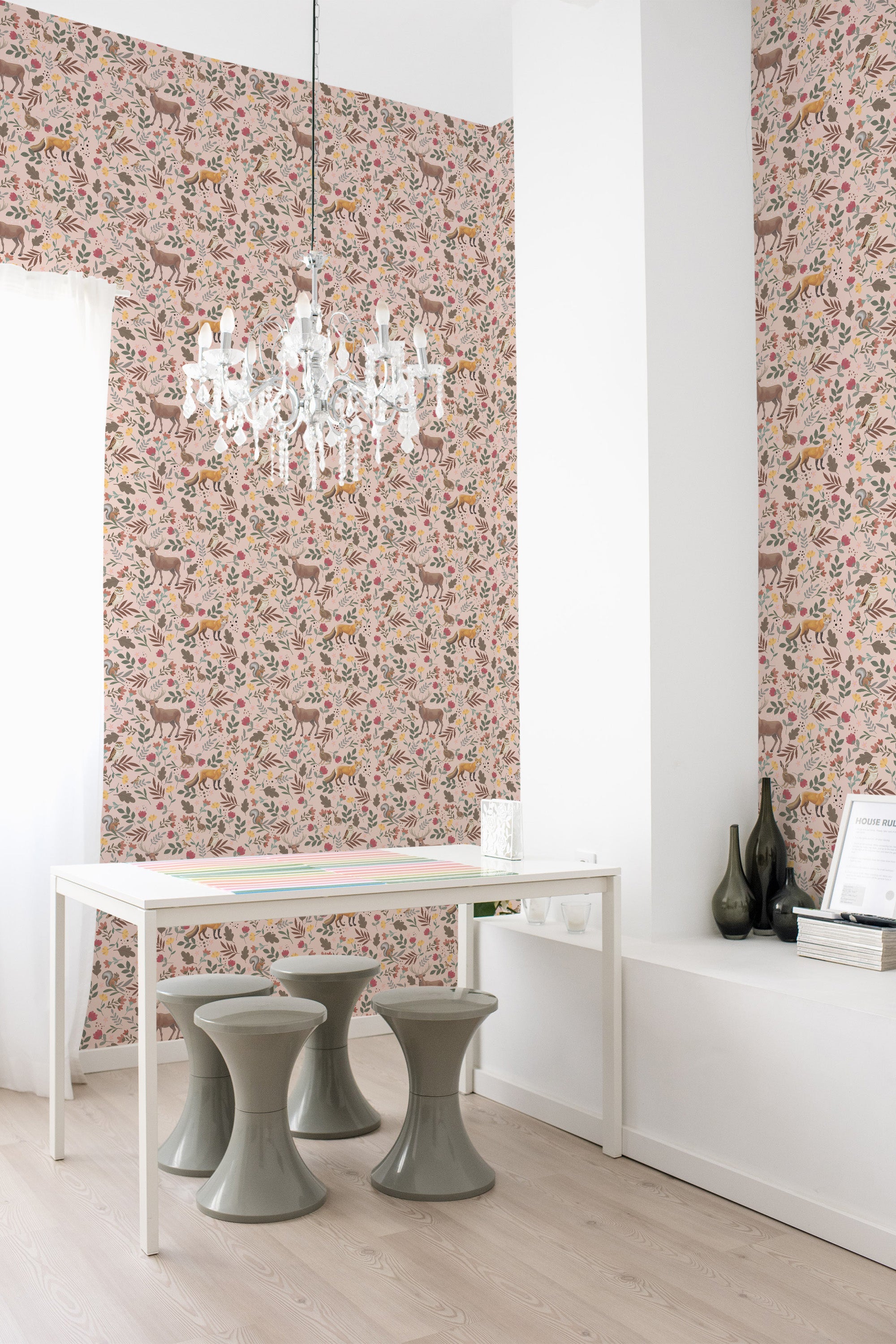 A room with pink Scandinavian-style forest wallpaper adorned with intricately detailed flora and fauna patterns in muted tones, adding a touch of nature to the space. Traditional wallpaper.