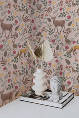 Self-adhesive wallpaper with a pink Scandinavian forest theme, incorporating playful woodland animals such as deer, foxes, and birds surrounded by colorful leaves and flowers in shades of pink, green, and yellow.