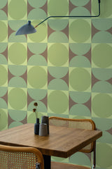 Self-adhesive wallpaper with a green geometric circle pattern, alternating between light and dark shades of green, forming a retro repeating circular grid.