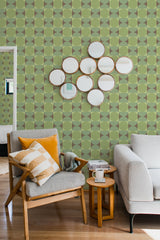 Green geometric circles align in a repeating pattern on the wall, creating a modern yet subtle visual rhythm. The design includes circular shapes interlocking with each other on a light green background, complementing the room with a clean and cohesive appearance. The wallpaper adds a fresh and calming ambiance to the space, achieving a perfect balance of contemporary and classic style. This is traditional wallpaper.