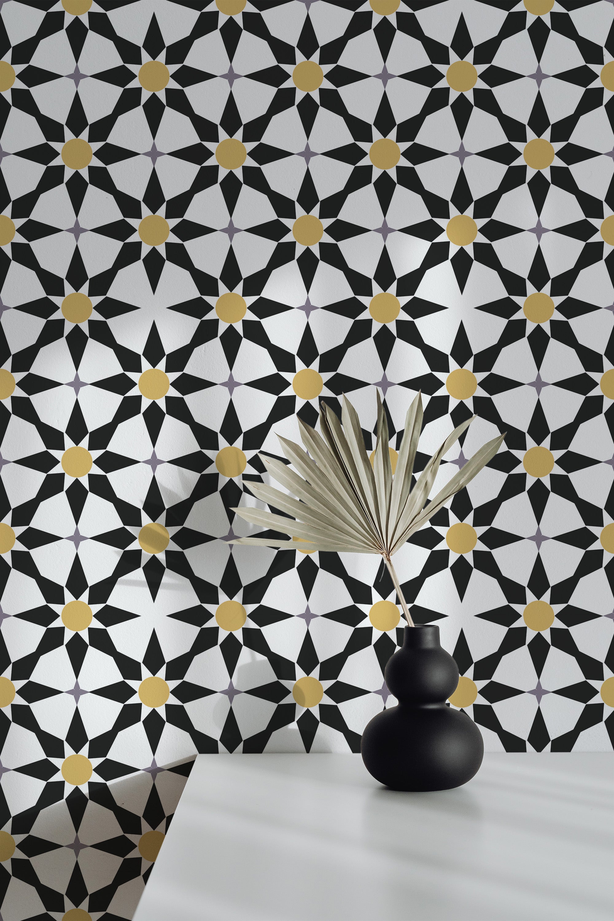 Self-adhesive wallpaper in a black star tile pattern with geometric shapes in black and white, accented by gold circular details at the center of the stars.