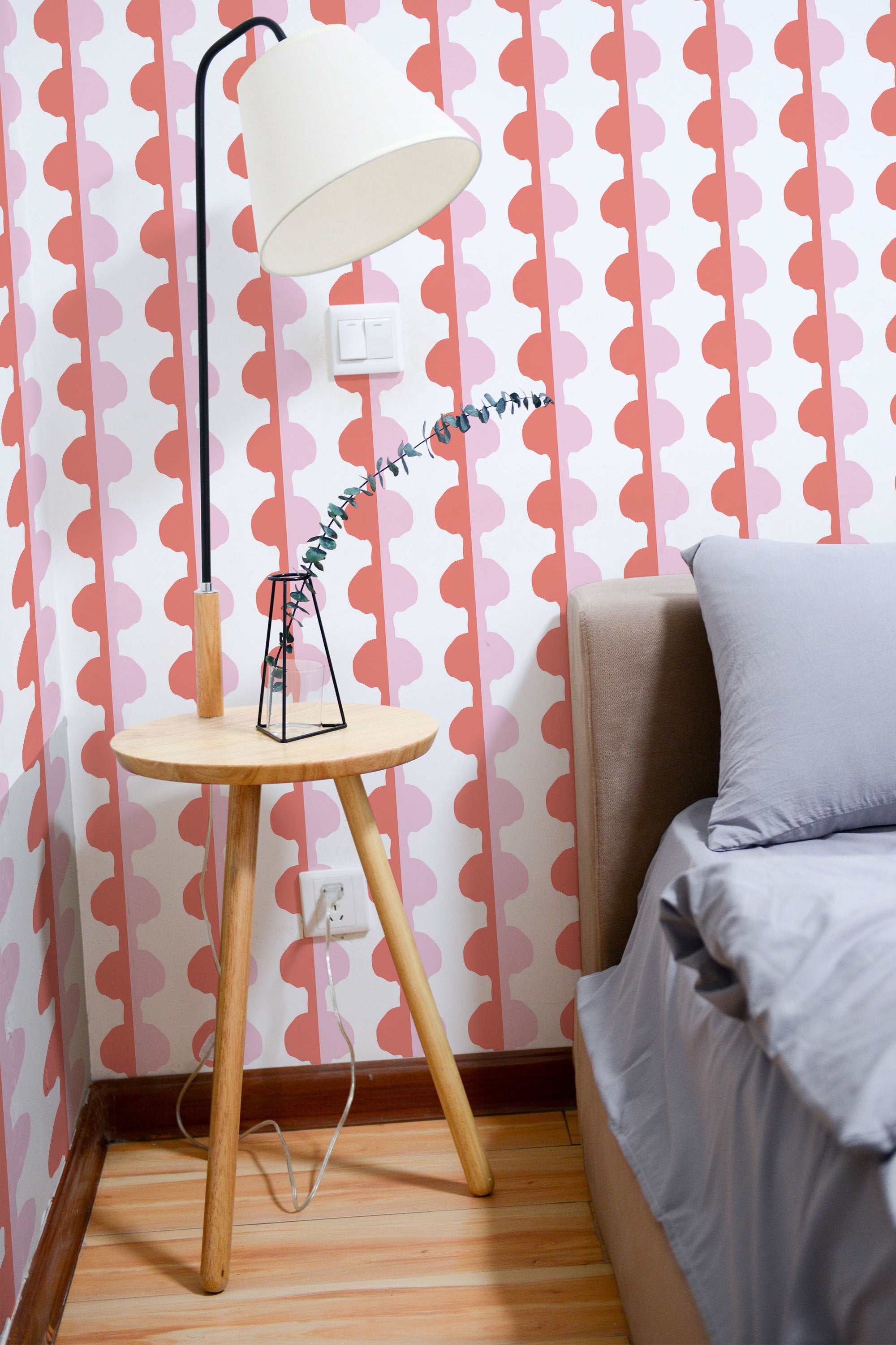 Self-adhesive wallpaper with a Pink eclectic stripe design, featuring alternating wavy stripes in shades of pink and red on a white background.