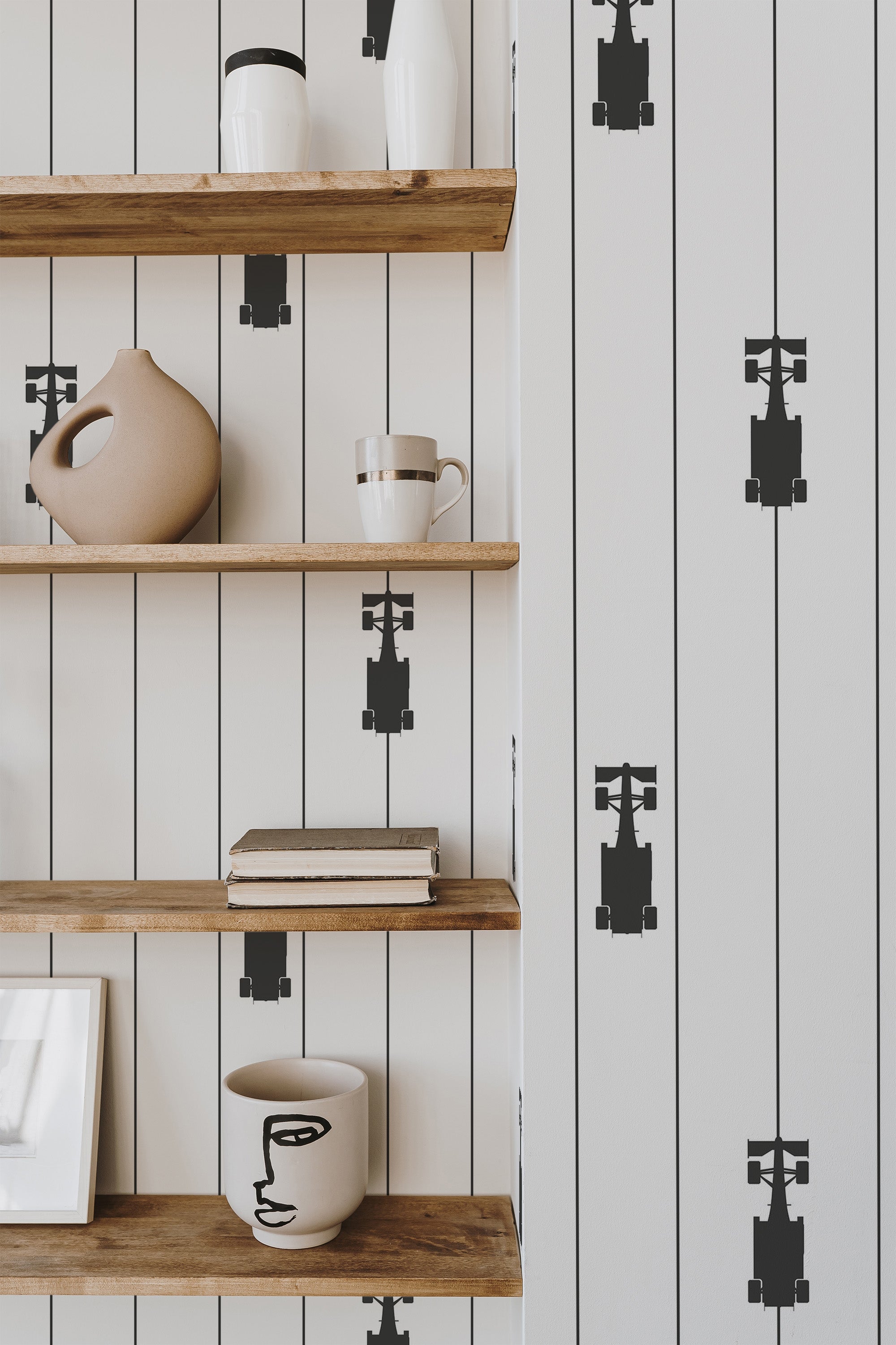 Self-adhesive wallpaper with a Formula 1 stripes design, featuring vertical black lines with stylized race cars evenly spaced along the lines, on a light background.