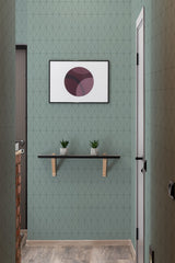 Green geometric tile patterned wallpaper with clean, interlocking diamond shapes creating a modern and structured look in the room. Traditional wallpaper.