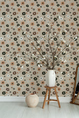 Self-adhesive beige wallpaper with a 70s retro floral design, featuring brown, white, and dark green flowers in a repeating pattern on a soft beige background.