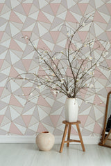 Self-adhesive wallpaper with a Pastel apex design in soft pink, beige, and white triangular patterns, creating a modern geometric look.