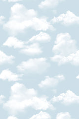 A soft blue background with scattered fluffy white clouds creating a serene, sky-like atmosphere. Perfect for a calming, airy room aesthetic. Peel and stick removable wallpaper.