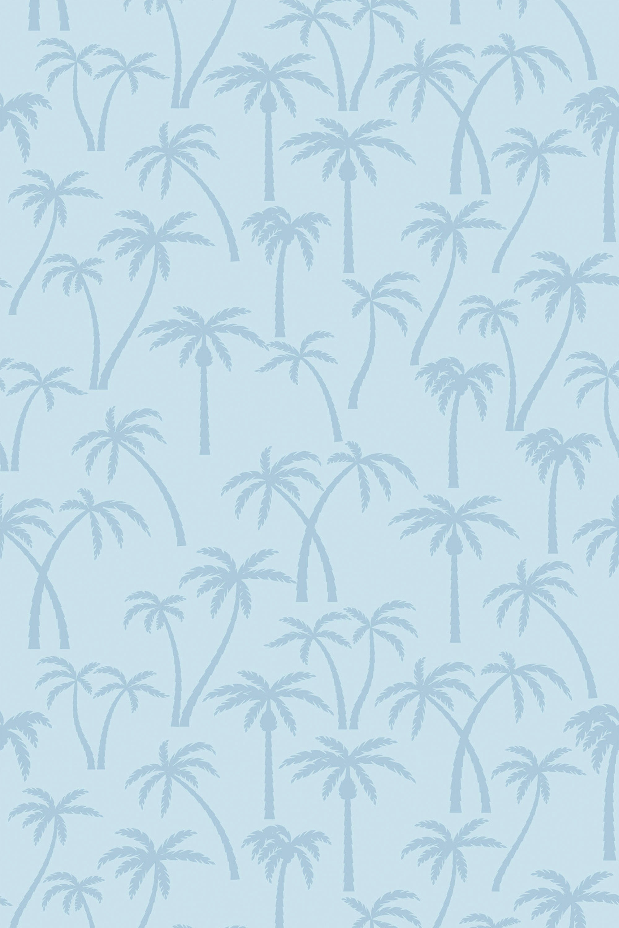 An elegant light blue wallpaper with a repeating pattern of silhouetted palm trees scattered across the surface. Peel and stick removable wallpaper.