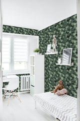 Green hearts wallpaper with a repeating pattern of variously shaded green hearts on a dark background, creating a lively and cozy atmosphere in the room. Traditional wallpaper.