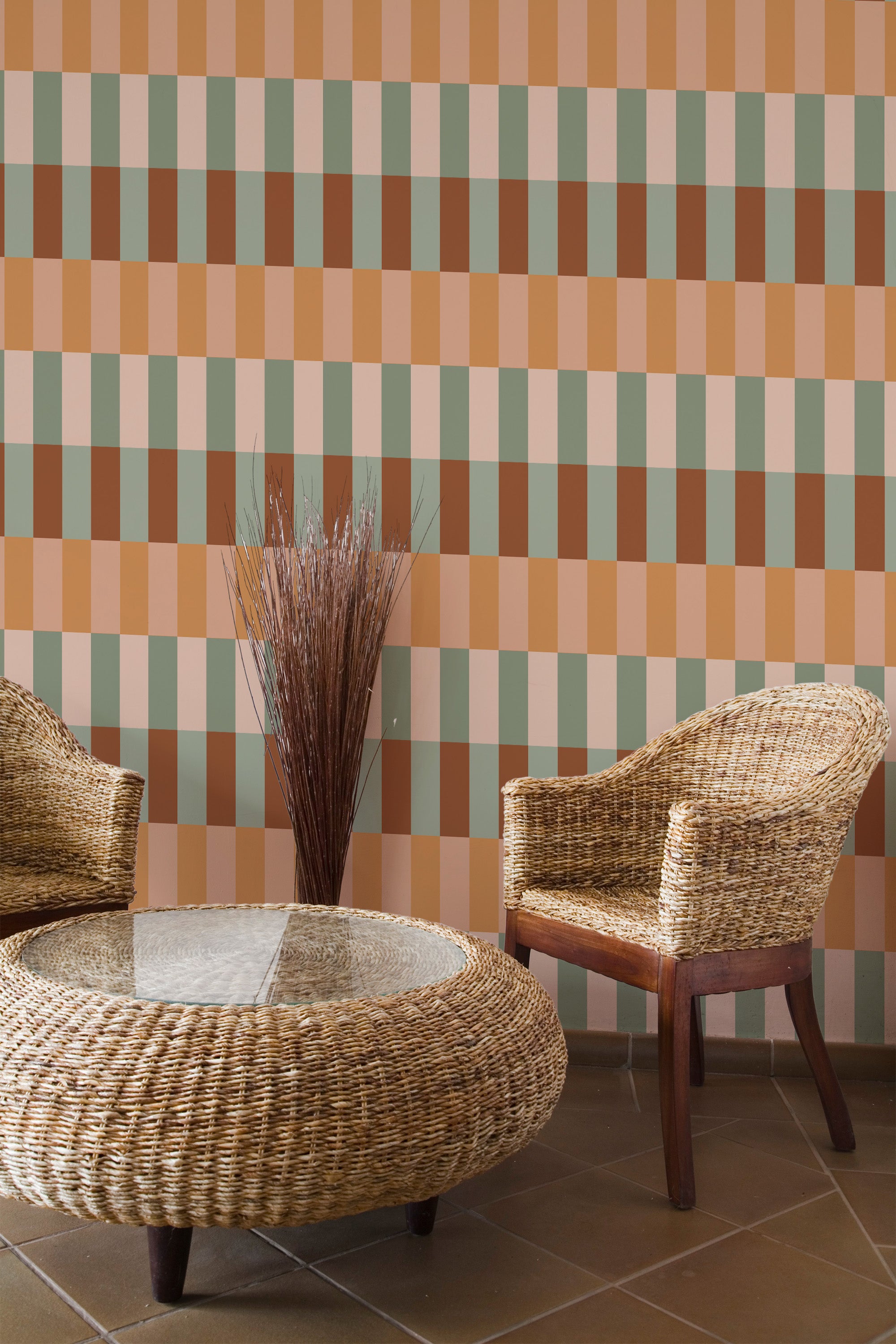 Self-adhesive wallpaper in an earthy geometric pattern with vertical stripes in muted tones of orange, brown, green, and cream, creating a warm and modern aesthetic in the room.