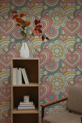 Self-adhesive wallpaper with a Pastel Retro design combining intertwined hearts and floral patterns in soft shades of pink, yellow, and blue.