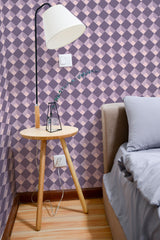 Self-adhesive wallpaper with a purple check pattern in alternating light and dark shades, creating a geometric, diamond-like visual effect.