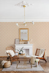 Retro flower grid wallpaper with small, evenly spaced floral patterns in warm red tones, creating a vibrant and nostalgic atmosphere in the room. Traditional wallpaper.