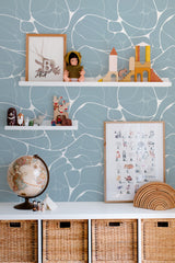 Self-adhesive wallpaper with a blue water design, featuring gentle, flowing white lines against a light blue background.